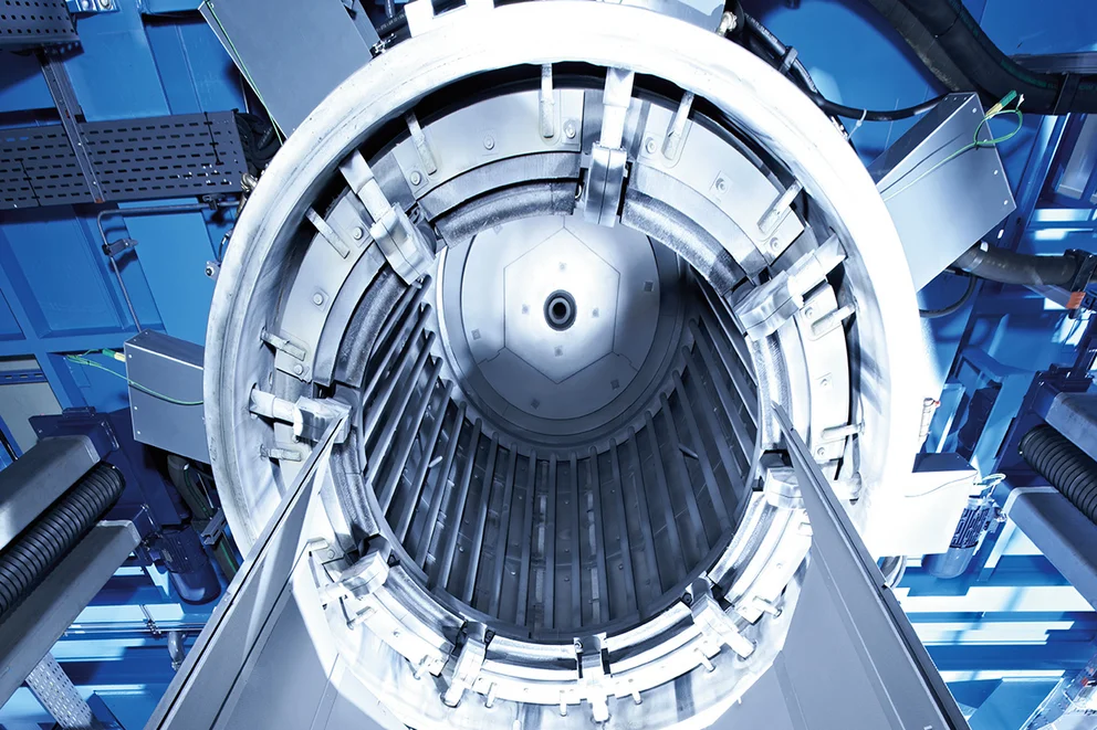 Interior view of a graphite purification furnace showing the cylindrical heating chamber