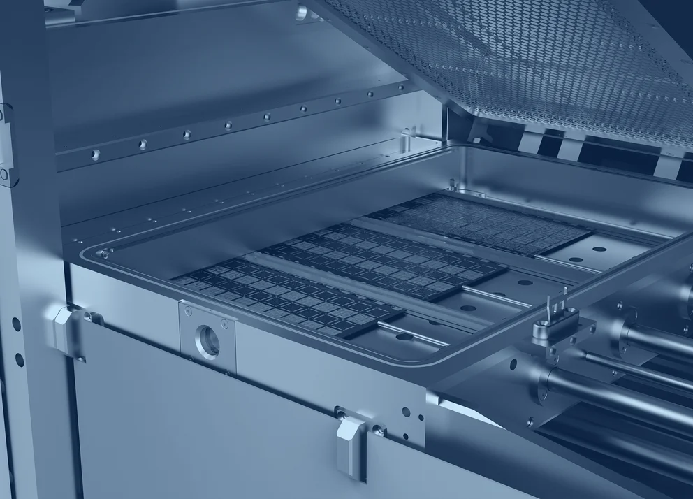 Open plasma processing chamber with internal electrode structures and carrier trays visible inside the system