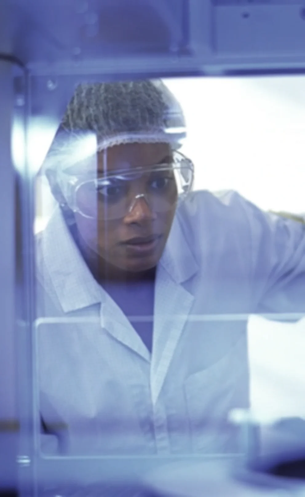 Person inspecting equipment in a lab environment